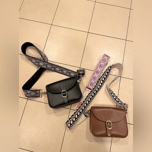 2 Vegan Leather purses (1 brown, 1 black) with 3 guitar style straps .